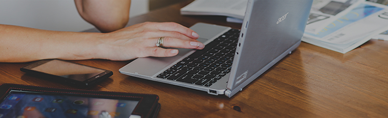 woman-hand-smartphone-laptop